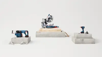 The 18V Bulldog Rotary Hammer, 2-in-1 impact driver and 18V Glide Miter Saw displayed on concrete blocks.